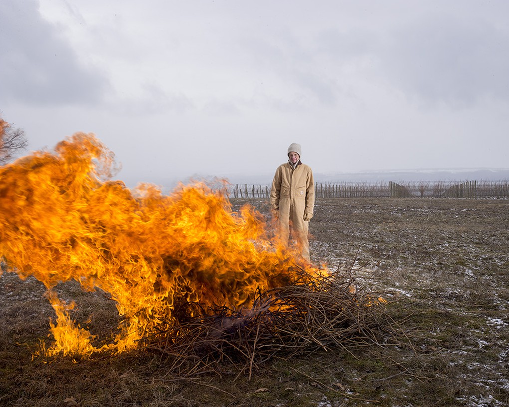 David Murray keeps an eye on the canes as they burn.